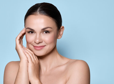 Beauty face concept. Beauty portrait of Caucasian young woman with healthy moisturized facial skin and natural plump lips