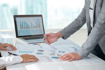 Fototapeta na wymiar accountant team review accounts report and using digital accounting program software on computer for working accounting standards system at office.