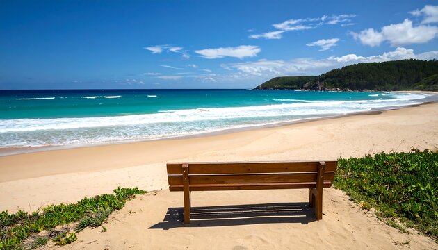 Sandy beach, tranquil ocean waves, wooden bench