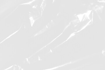 plastic overlay texture of realistic crumpled transparent plastic film wrap on black background,wrinkled stretched plastic effect.