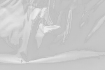 plastic overlay texture of realistic crumpled transparent plastic film wrap on black background,wrinkled stretched plastic effect.