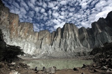 Mountainous landscape with a tranquil lake nestled in a valley