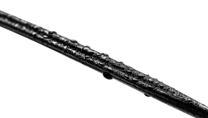 Close-up of a metallic rod, wet with water droplets