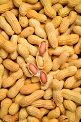 Background of nuts. Unshelled peanuts close-up. Nut texture.