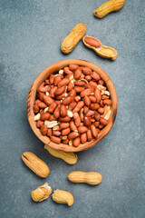 Shelled peanuts in a wooden bowl. Nuts close-up