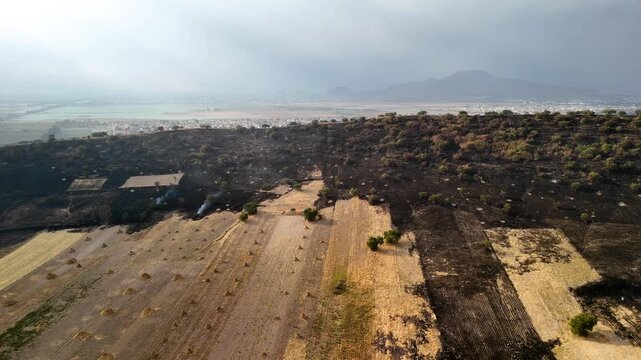 lateral shot of a fire at the volcano crater in chalco mexico