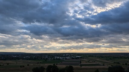 Dramatic Cloudy Skies Stretching Over the Beautiful Countryside Landscape at Dusk