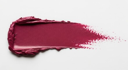 Rich berry colored lipstick swatch texture on white background
