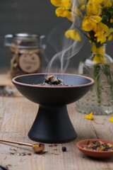 Beltane incense ritual with frankincense, resins and dried herbs - spiritual mood