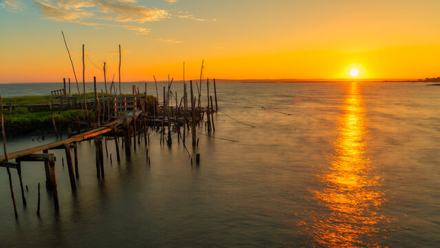 Old fishing pier - Carrasqueira Comporta Palaf&iacute;tico Pier - The Carrasqueira Comporta Palaf&iacute;tico Pier is a place known as an architectural masterpiece. Travel and Art concept.