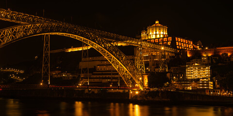 Close up view of illuminated Ponte Dom Luís I at night. Porto, Vila Nova de Gaia, Portugal. Travel...