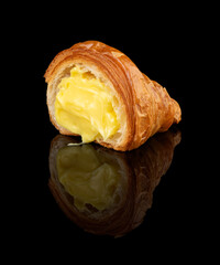 Croissant with Vanilla Custard &ndash; Angled, black background with reflection