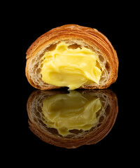 Croissant with Vanilla Custard &ndash; Low angle, glossy reflection, black background