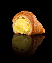Croissant with Vanilla Custard &ndash; Angled, black background with reflection
