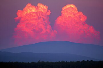 Fiery clouds over a mountain range at sunset