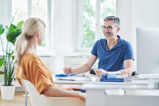 Patient having discussion with doctor at medical practice