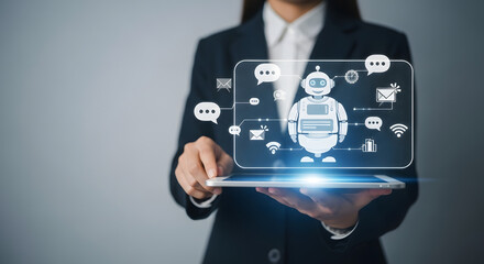 Businesswoman holds a tablet displaying a digital chatbot interface, showcasing AI technology.