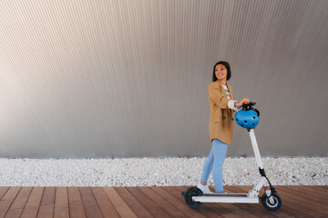 Asian woman ride e scooter