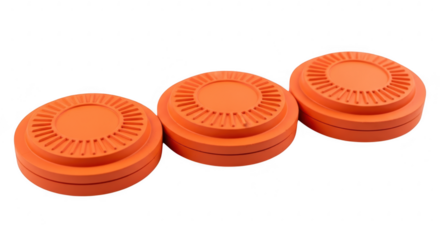 Three orange clay targets are arranged for a shooting sport competition on a transparent background