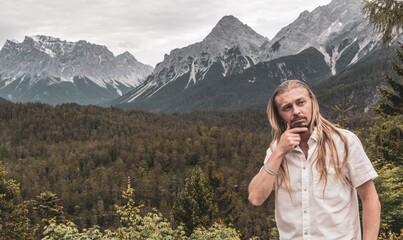 Man male tourist model at Zugspitze mountain panorama Tyrol Austria.