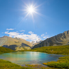 emerald lake in mountain valley at the sunny day
