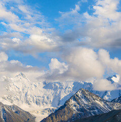 snowbound mountain ridge in mist and dense clouds, mountain travel scene