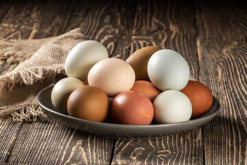 Charming display of eco-conscious chicken eggs on rustic wooden farm table