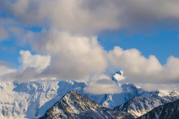 snowbound mountain ridge in mist and dense clouds, mountain travel scene