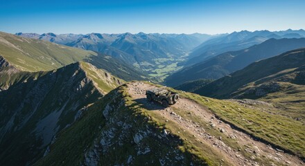 Obraz premium Majestic mountain drive: a rugged vehicle conquers a peak offering breathtaking alpine panorama