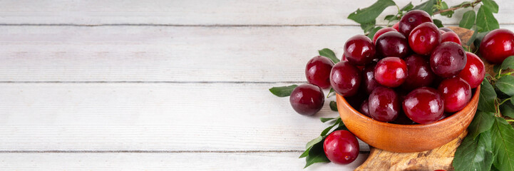 Fresh raw ripe cherry plum with leaves