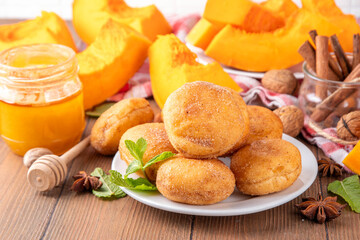 Autumn pumpkin pie donuts with cinnamon sugar sprinkled topping