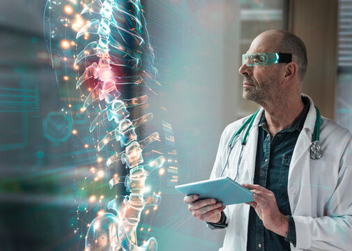 Doctor examining spine wearing futuristic glasses using AI technology in lab