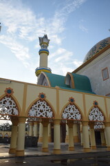 The magnificent architecture of the Grand Mosque in Mataram City, Lombok Island, Indonesia, against a blue sky