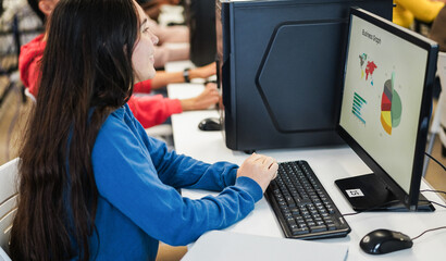 Young students using computers during business class at school university - Back to college and campus lifestyle concept - Focus on girl hand