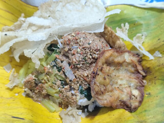 Nasi pecel or sego pecel is a typical Javanese Indonesian rice dish served with pecel sauce, which...