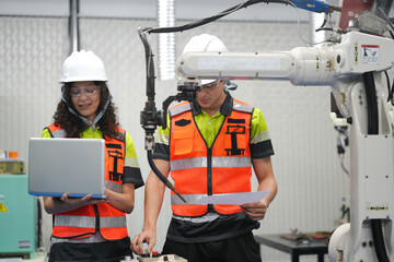 Smart Latino engineer working on AI technology in robotics electronics engineering laboratory....