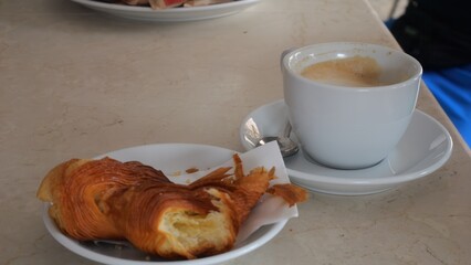 A Delicious Morning Coffee and Croissant on a Table Creating a Perfect Breakfast Setting for a Relaxing Day Start
