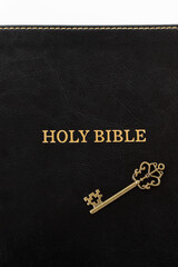 Holy bible book with ancient key. Top view. God's revelation, prophecy, and wisdom, christian biblical concept.