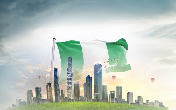 Nigeria national flag wavering with modern building skyline. Country showing stronger and prosperity. Flag key visual. Nigeria national flag for independence day.