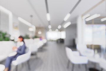 Blurred office interior with natural wooden elements and green plants, creating a calm and...