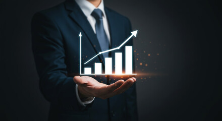 Business Growth at Hand: A sharp, focused businessman presents a projected graph depicting business success in a dark, futuristic setting. 