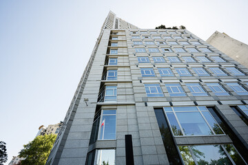 Modern high-rise building with glass windows in an urban setting