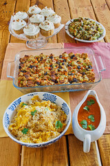 holiday side dishes including brussels sprouts, yellow squash, pumpkin cupcakes, and tomato gravy