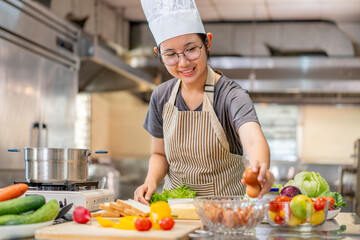 Happy Young Asian Female Chef Prepares Ingredients