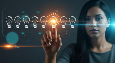 Obraz premium Professional woman pointing at one glowing light bulb among several, representing a bright idea, innovation, or choosing the best solution