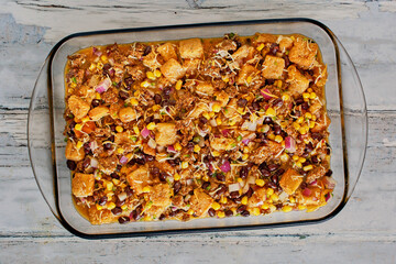 Southwest style breakfast casserole with eggs, sausage, black beans, salsa, and sour cream