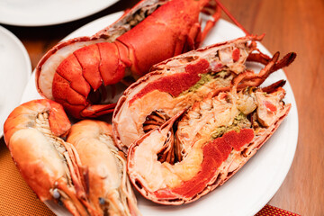Cooked Lobster and River Prawns Served on a White Plate
