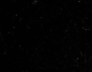 Fototapeta premium Overlay texture emulating old 8mm film with floating dust particles, hairline scratches, and occasional flicker. Black background with transparent film effects suitable for vintage and retro-style