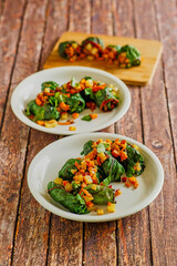 swiss chard rolls rolled with parsnips, butternut squash, potato, and bacon