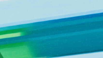 Minimal abstract close-up of green gradient surface with motion blur effect. Clean modern background ideal for digital art, tech, or design templates.